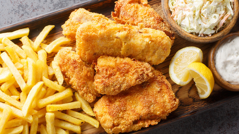 Quintessential Wisconsin fried fish with marbled rye bread, coleslaw, and potato pancakes.