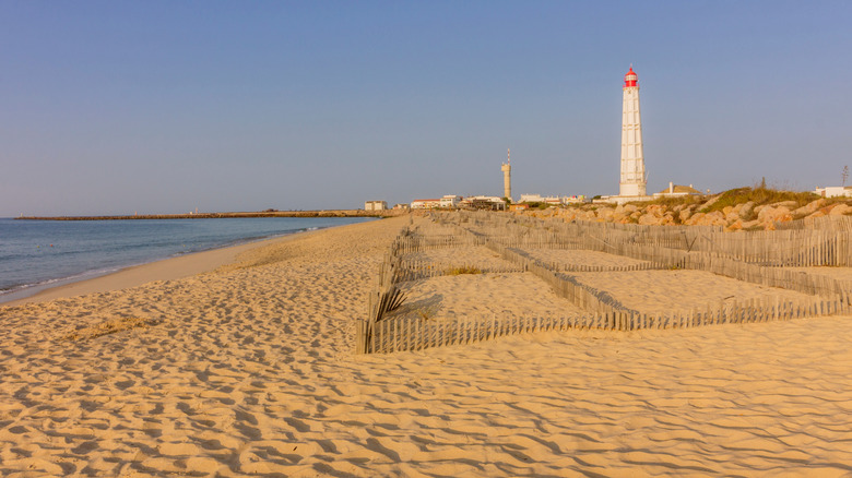 Cabo de Santa Maria lighthouse viewed from Farol's secluded beach