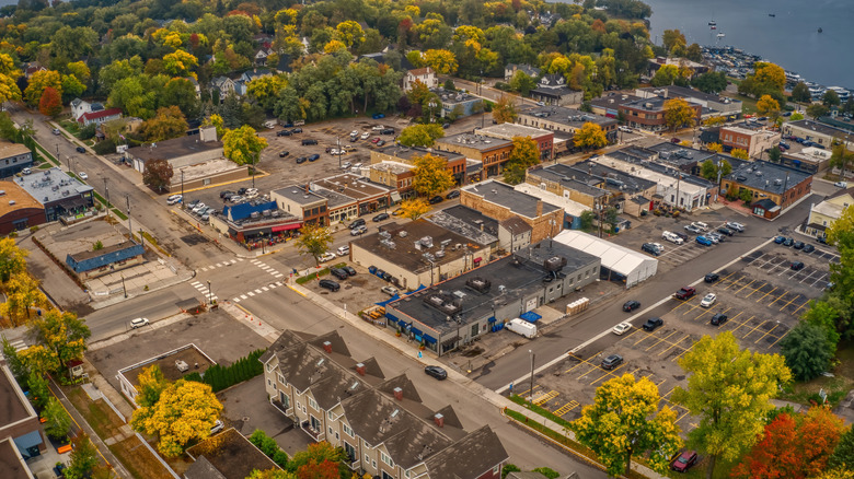 A small suburb surrounded by trees on the waterfront