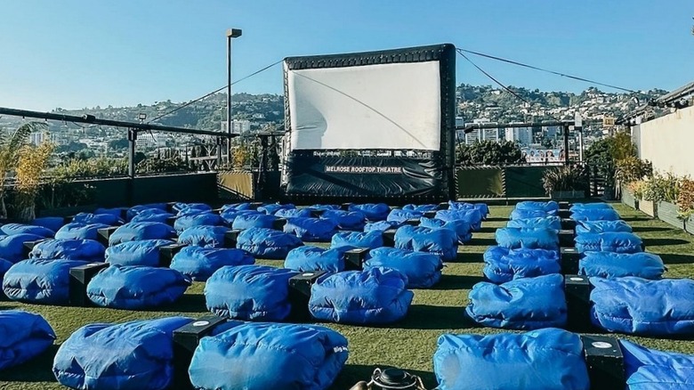 Rows of blue bean bag chairs on a rooftop at the Melrose Rooftop Theatre in Los Angeles