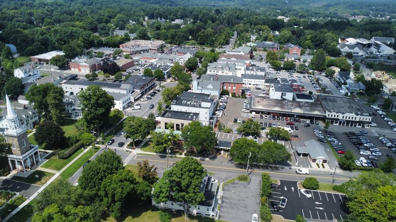 aerial view of buildings and trees and parking lots