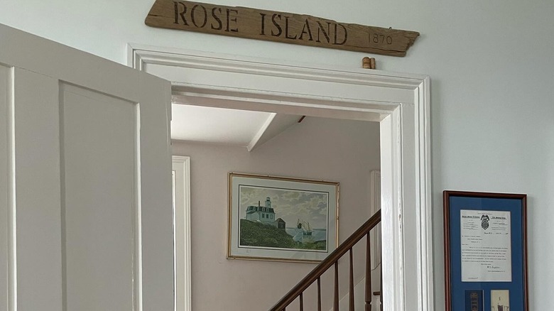 Entryway inside Rose Island accommodations including a painting of the lighthouse