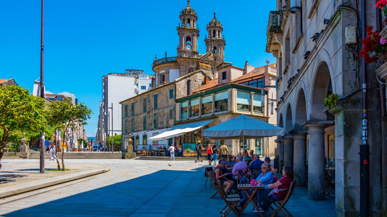 People at an outdoor cafe in Pontevedra, Spain