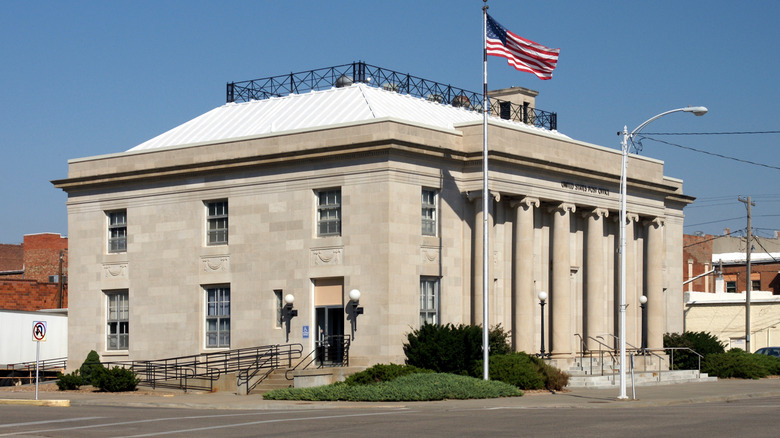 Concordia's Post Office exterior with American Flag at full staff