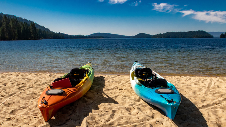 Two kayaks on a beach on Payette Lake