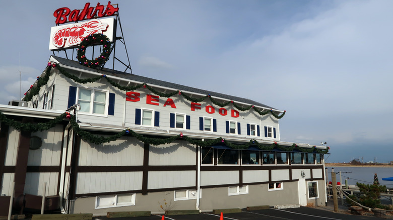 Exterior view of Bahrs Landing Seafood Restaurant in Highlands, New Jersey on a cloudy day.