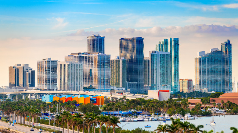 The Downtown Miami skyline rises gracefully over the MacArthur Causeway