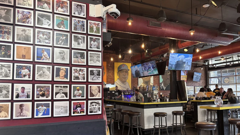 Interior of Mike's Beer Bar, featuring photographs and artwork of prominent Pirates players.