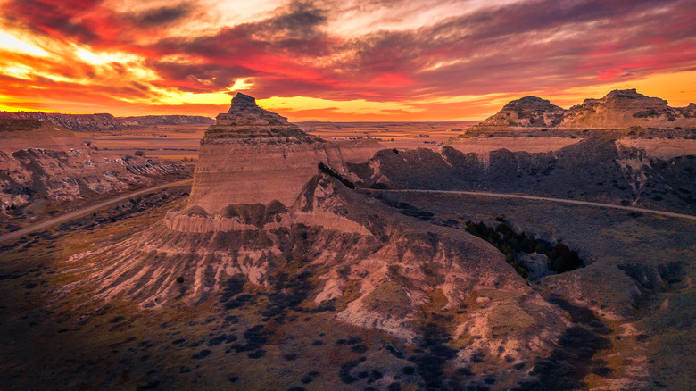 An aerial view of a bluff at sunset
