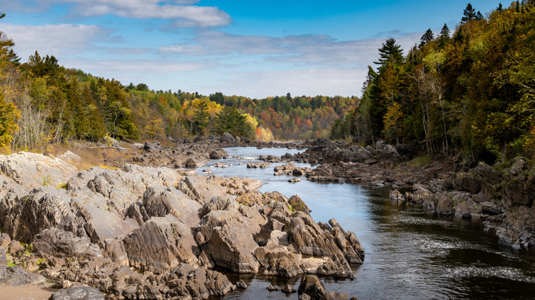 A rocky river surrounded by fall colors in Jay Cooke State Park in Minnesota.