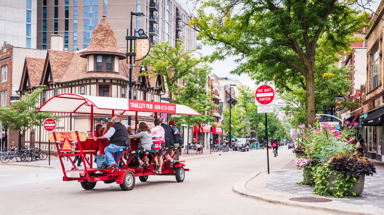 The heart of Madison, Wisconsin, with people riding down the street