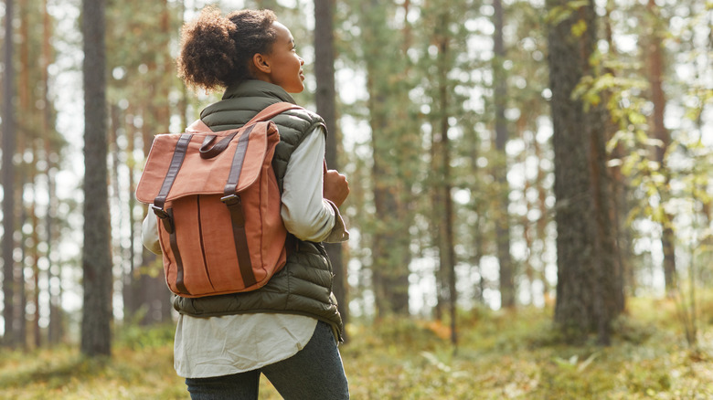 A woman hiking with backpack