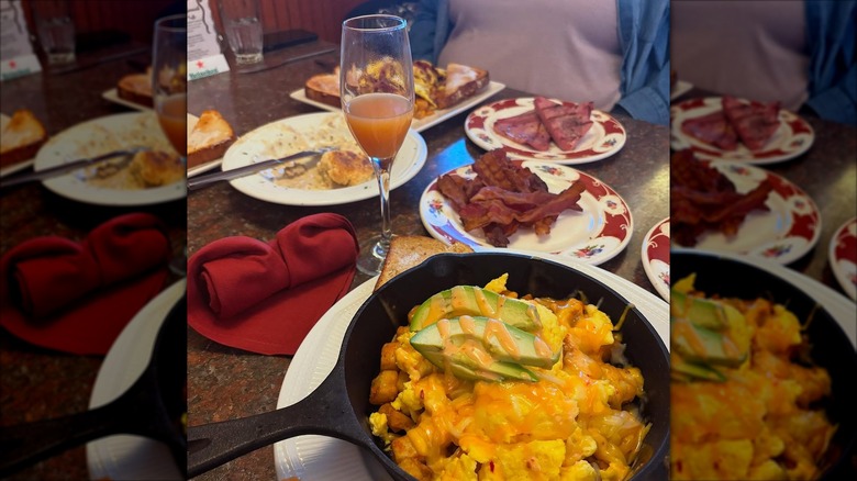 Brunch consisting of eggs, bacon, and mimosa from Sam's Seafood Steakhouse, Johnstown, New York