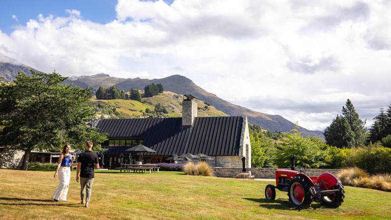 Exterior of Amisfield Restaurant with a tractor and two people