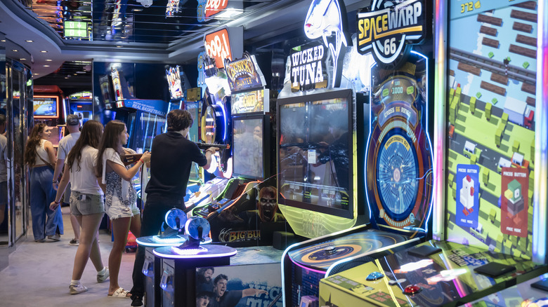 Kids playing arcade games inside an on-board arena on an MSC cruise ship.