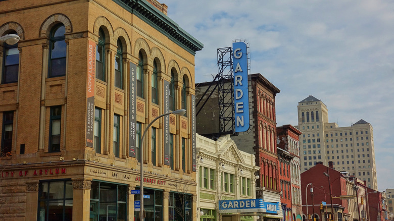 colorful yellow white and red buildings next to each other under blue sky