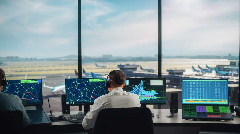 Two air traffic controllers in tower
