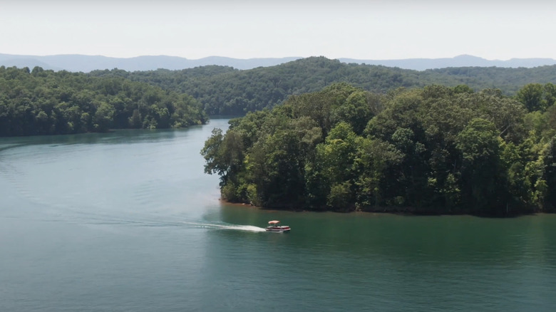 A boat zips through Norris Lake in Tennessee