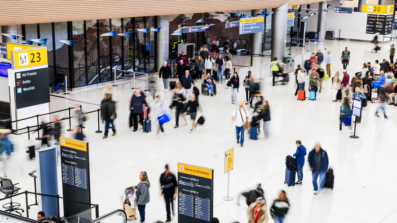 People walking through Denver International Airport