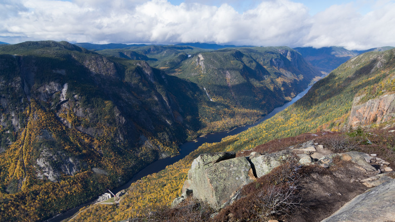 A mountain valley river extends into the distance