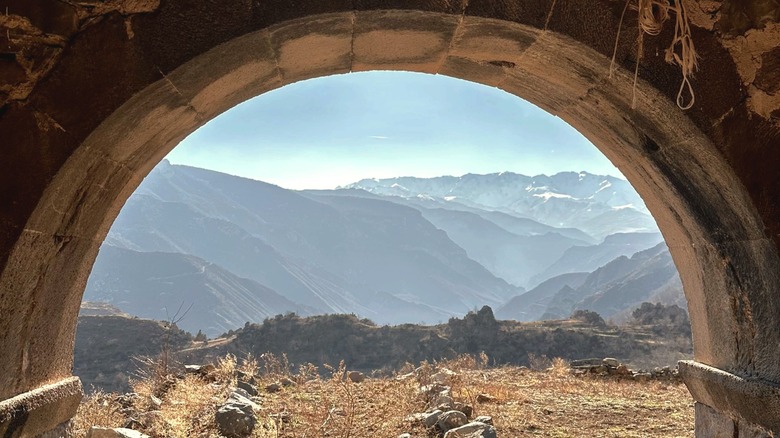 Mountains of Syunik Province in Armenia as seen from the entrance of an abandoned house in Hin Khot, Armenia