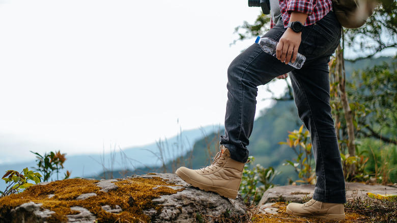 Person hiking with water bottle