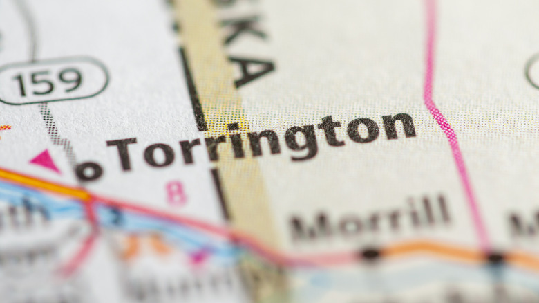 Close up of Torrington in Wyoming on a map with nearby roads and towns blurred.