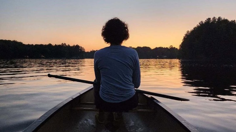A woman canoes at sunset near Phillips, Wisconsin
