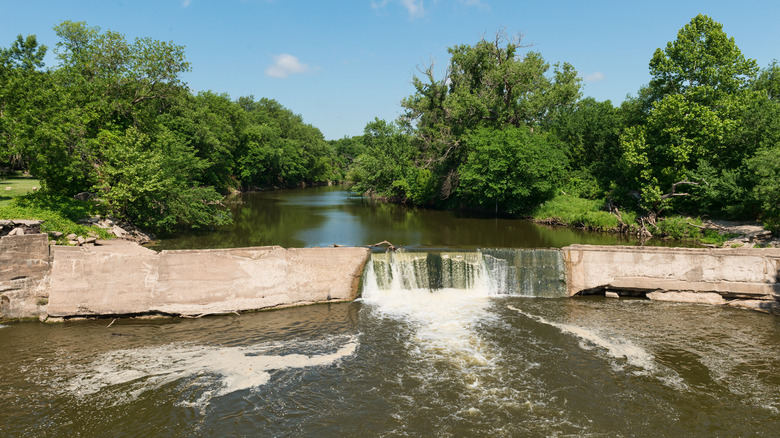 Water from the Cottonwood River flows over the dam at Bates Grove Park