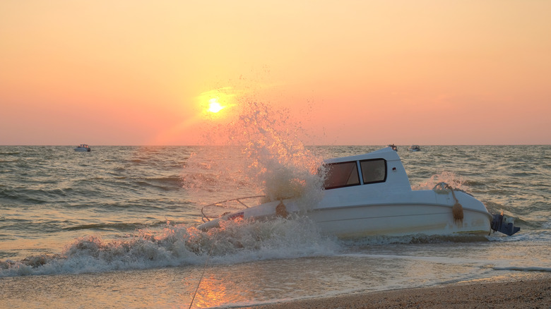 White boat capsized on a beach