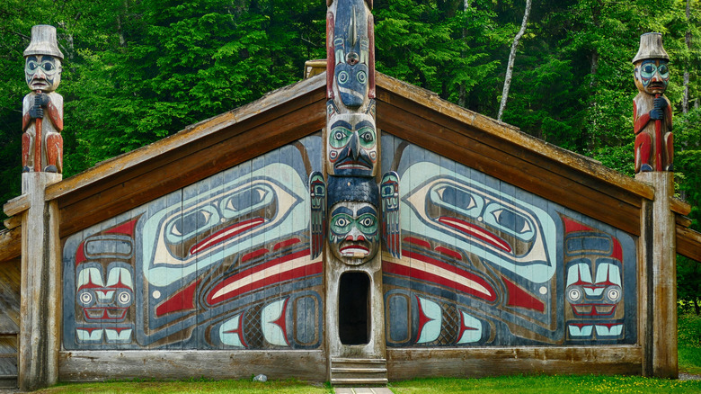 Alaskan clan house with colorful totems