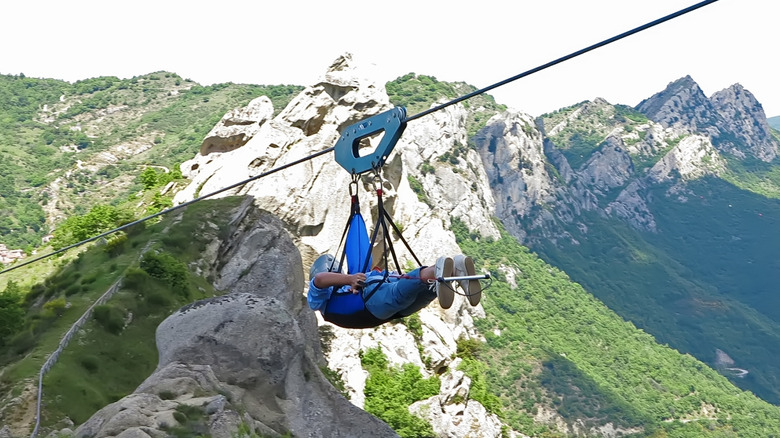 Tourist on the Angel's Flight zipline in Pietrapertosa