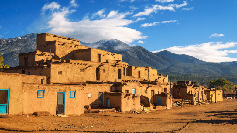 Taos Pueblo with mountains in the background