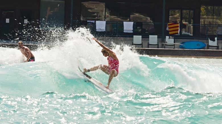 Woman surfing at Waco Surf