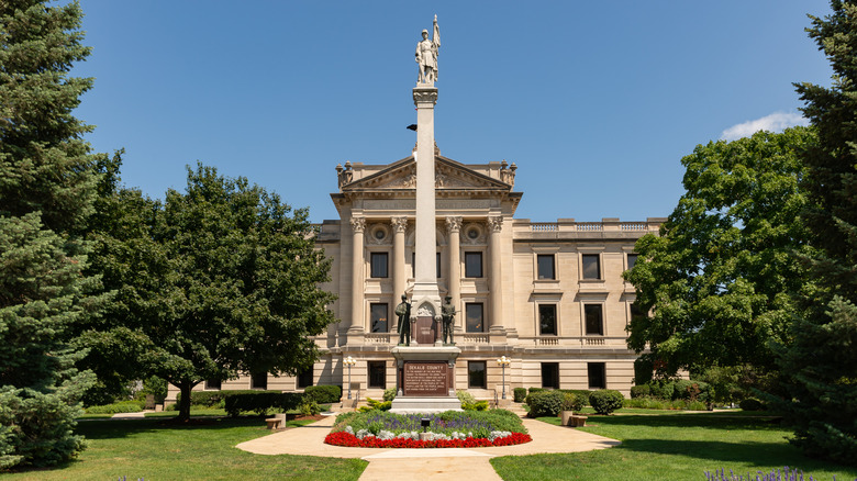Flowers and lush trees invite to Dekald County Courthouse