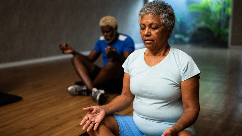 Two people meditating