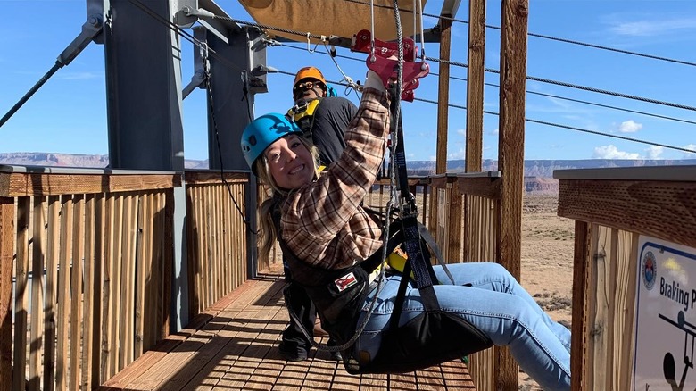 A woman gets ready to soar on a zipline