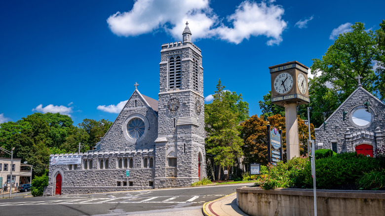 A historic stone church on a street corner in Ossining