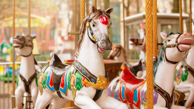 Colorful horses of a vintage carousel