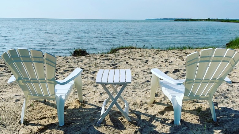 Two beach chairs look out over the Rappahannock River in Irvington, Virginia