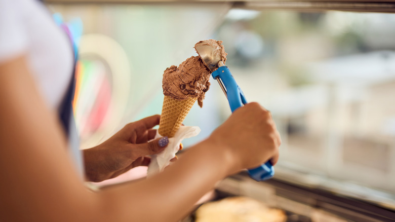 Server scooping ice cream