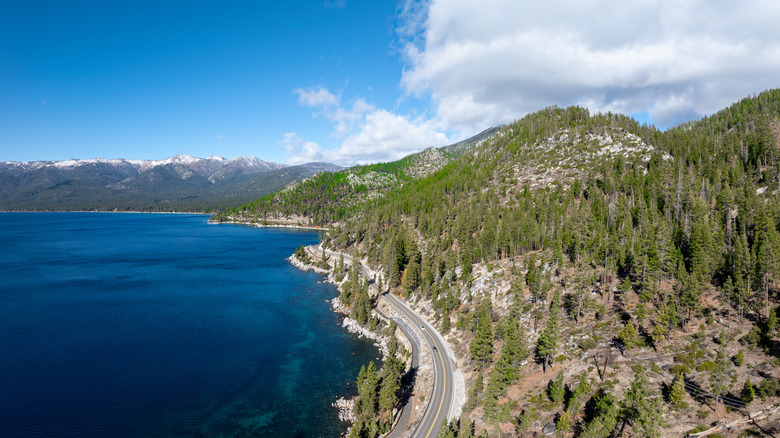 A road skirting the mountainous side of Lake Tahoe
