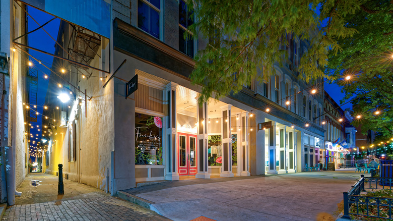 A street in Macon with lights on at night