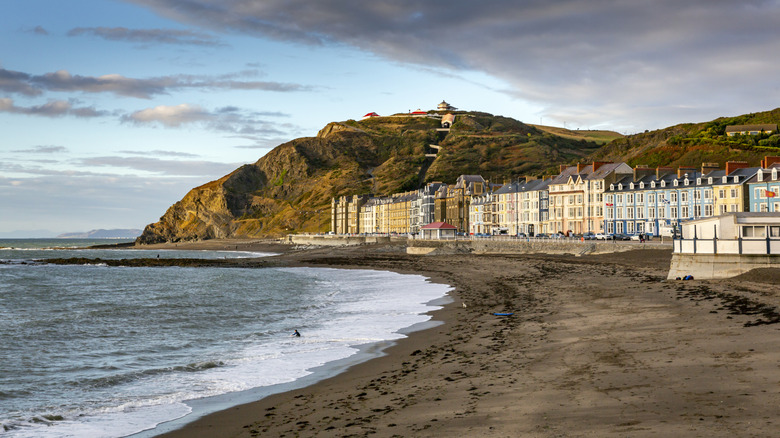 Grand buildings line up behind Aberystwyth's North Beach