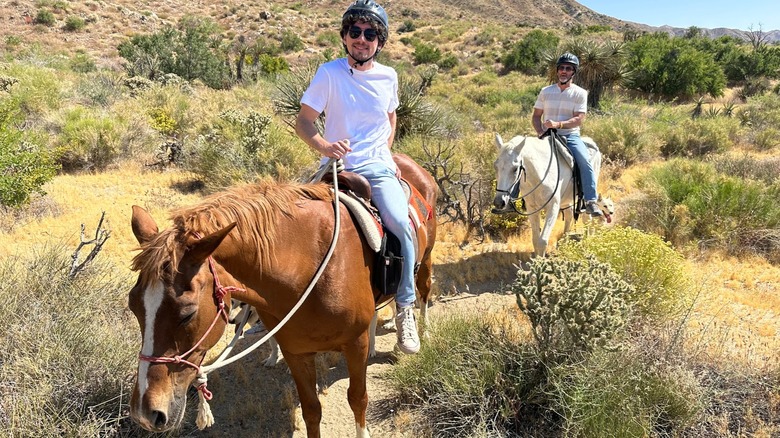 Two riders on horses at Crazy Horse Ranch