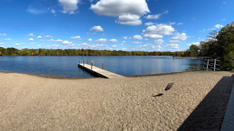 Sandy swimming beach and dock on a lake in Cleary Lake Regional Park.