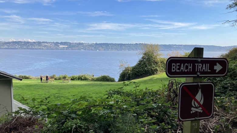 Sign for beach trail with views across the bay at Possession Point State Park in Washington
