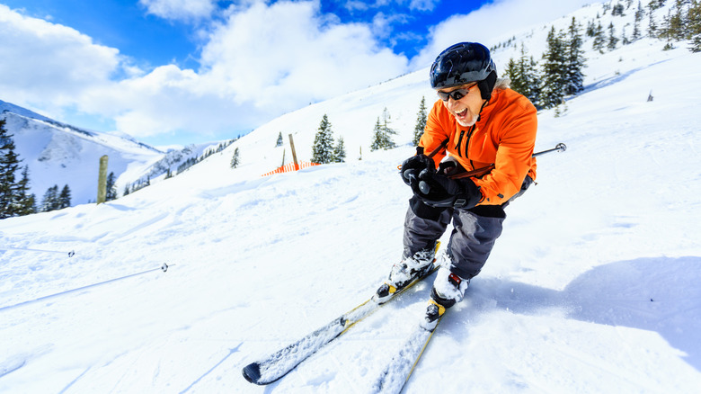 Active senior skier on a mountain slope