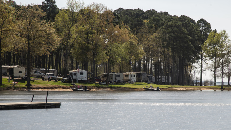 Campers and RV on the lake at Cypress Bend State Park