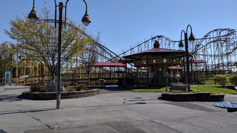 Front view of the Wildcat and merry-go-round at Adventure Park USA
